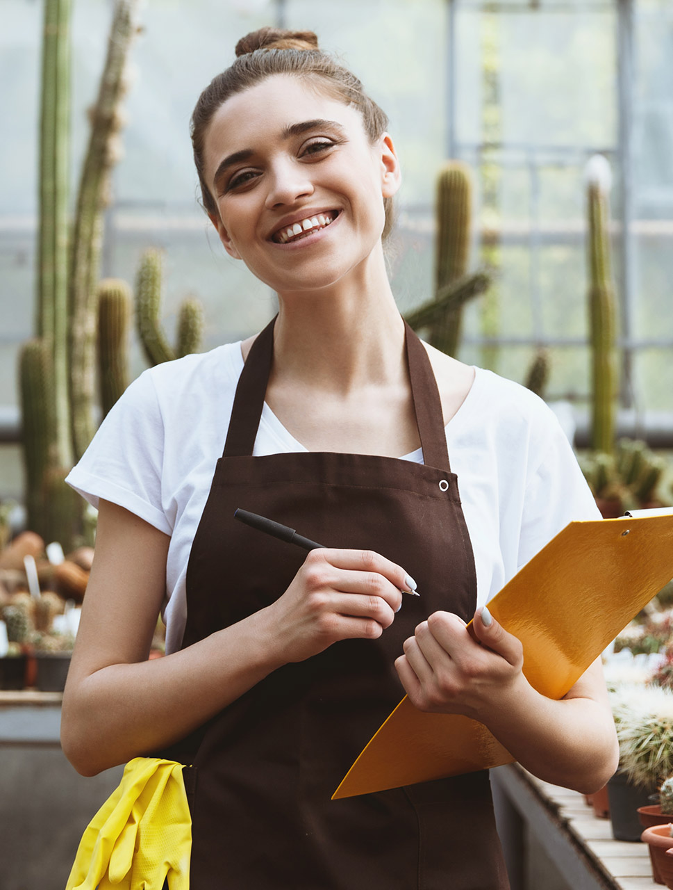 woman-working-in-greenhouse-agriculture-services